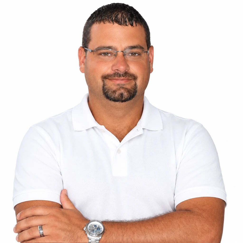 Portrait of a man in a white polo shirt with arms crossed