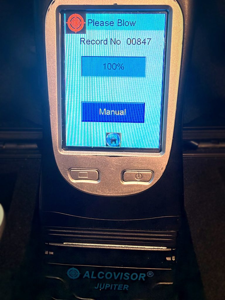 Our Alcovisor Jupiter breathalyzer showing its Please Blow screen