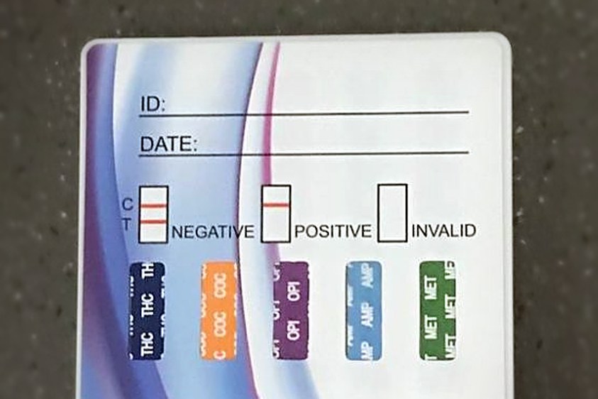 Instant multi-drug screen test card on a counter